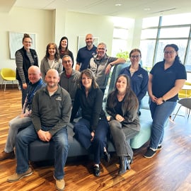 PREMIER Employees sitting on couch in bank building 