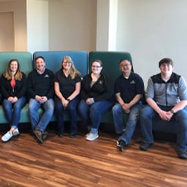 PREMIER Employees sitting on couch in bank building 