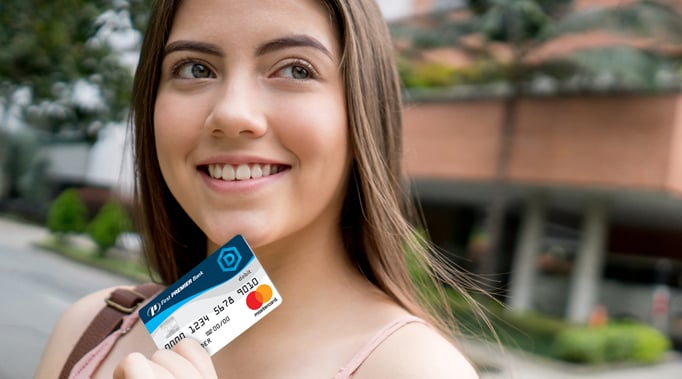 woman looking at credit card