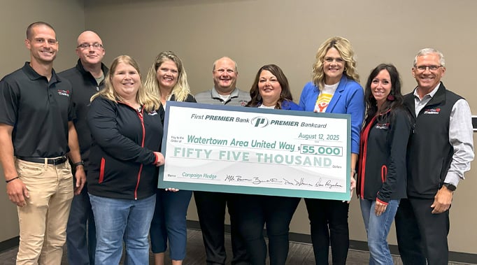 Leadership team standing with United Way representatives