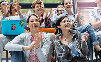 students in classroom clapping