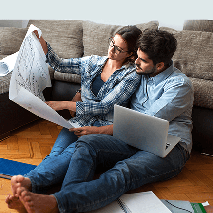 couple looking at house blueprints