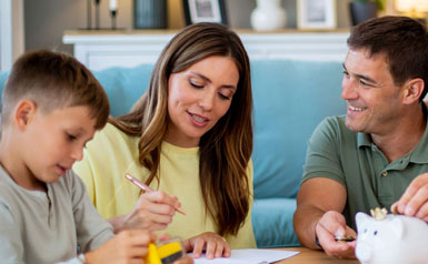 Parents with child and piggy bank