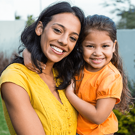 mother holding daughter