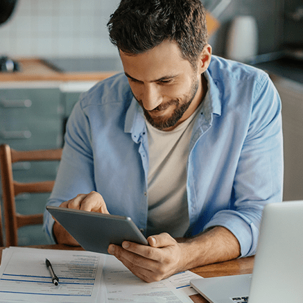 male looking at tablet