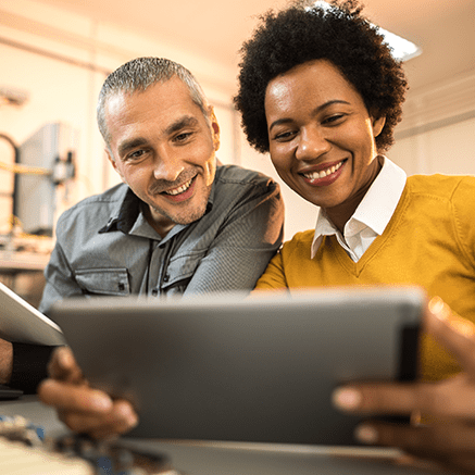 Male and Female looking at tablet