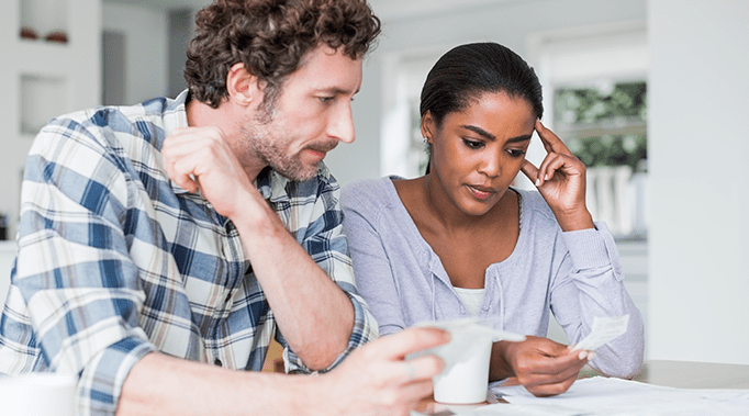 couple looking at receipts