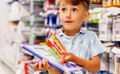 Kid holding craft supplies